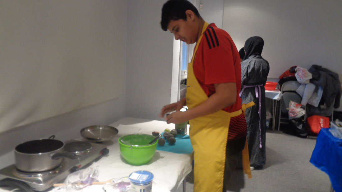 Young people cooking at youth club